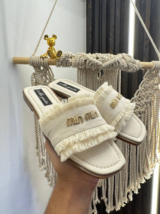 MiuMiu slippers are the hottest trend this season.