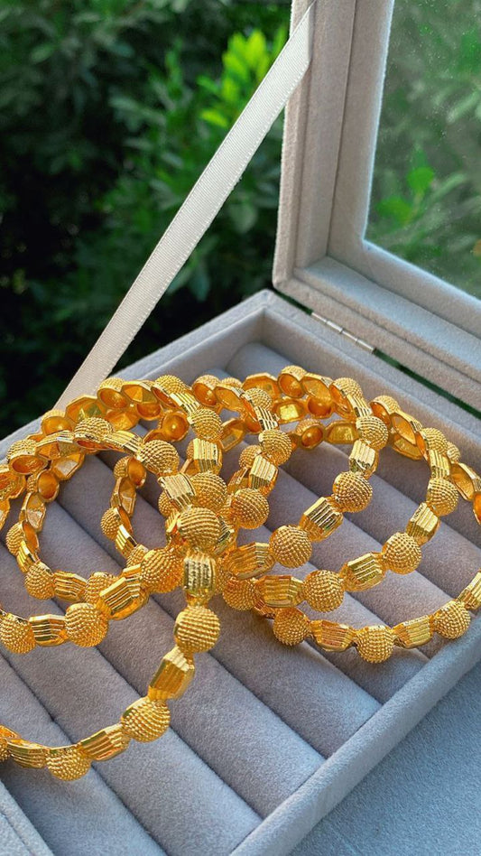 Golden pearl bracelets - luxury that suits your wrist, gold-plated, with a wonderful design, consisting of (4 pieces) - luxury that suits your wrist 