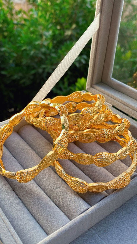 Traditional Saudi heritage bracelets plated with gold, with a wonderful design, consisting of (4 pieces) - a golden touch that completes your elegance