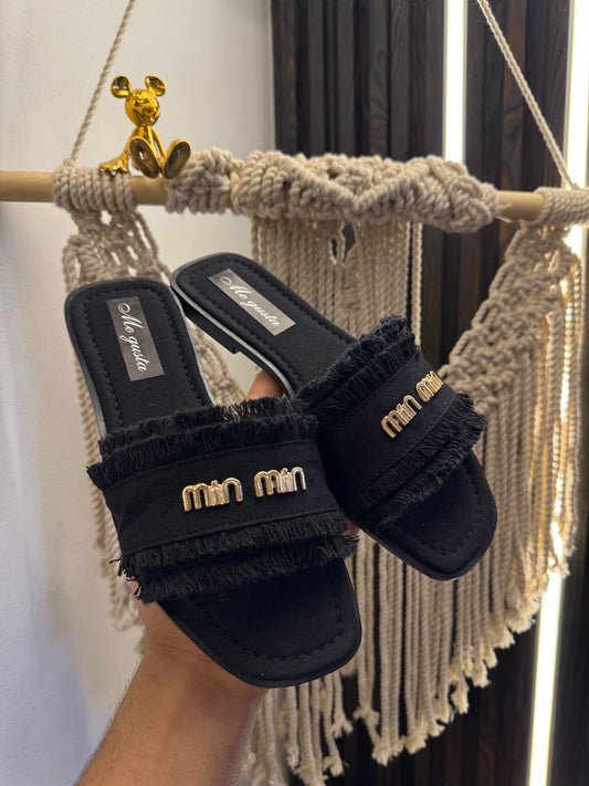 MiuMiu slippers are the hottest trend this season.